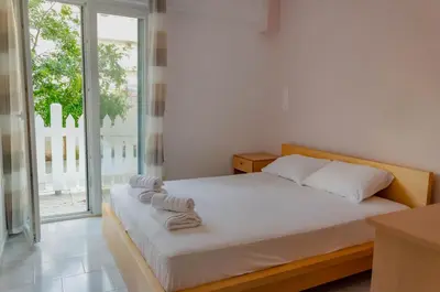 a bedroom with a bed with towels on it at Amaradios in Rhodes Town