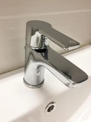 a chrome sink faucet on a white sink at Amaradios in Rhodes Town
