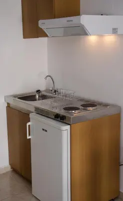 a kitchen with a sink and a counter top at Amaradios in Rhodes Town
