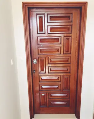 a wooden door in a room at Zelos Rhodian House in Rhodes Town