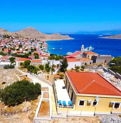 an aerial view of a small town with a house at Villa Cassandra in Halki