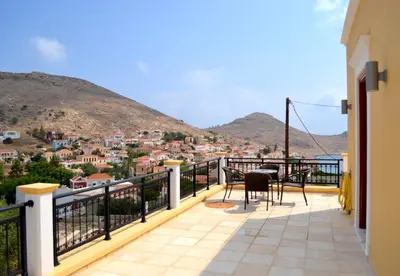 a balcony with a view of a city at Villa Cassandra in Halki