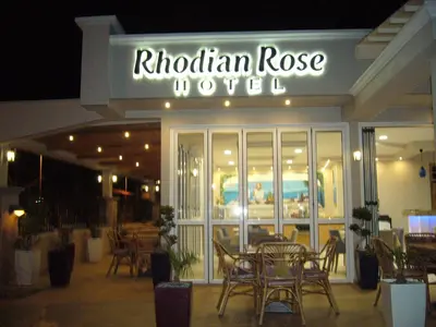 a restaurant with a table and chairs in front of it at Rhodian Rose Hotel in Faliraki
