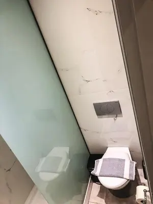 a bathroom with a toilet in a room at Omiros in Faliraki
