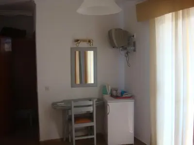 a bathroom with a sink and a mirror at Omiros in Faliraki