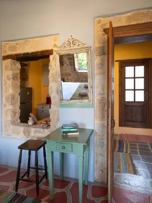 a room with a table and a mirror and a bed at Colours - Old Town - Studios in Rhodes Town