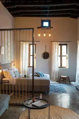 a bedroom with a bed with a cage in it at Colours - Old Town - Studios in Rhodes Town