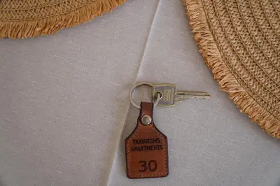 a brown tag on a shirt with a zipper at Taxiarchis in Symi