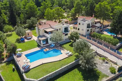 an aerial view of a house with a swimming pool at Seven Springs Villas Artemis Villa in Kolimbia