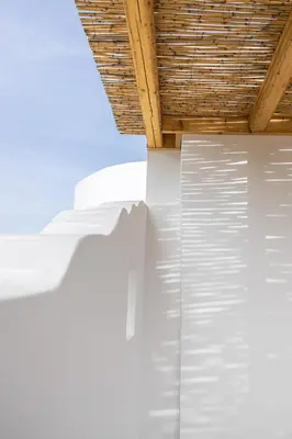 a wooden roof on top of a white building at Villa Mamma Mia in Gennadi
