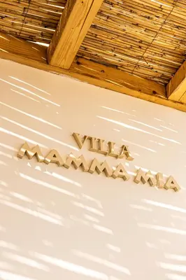 a sign on the ceiling of a room with the word avalon on it at Villa Mamma Mia in Gennadi