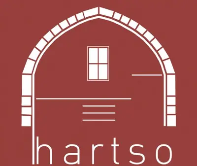 an arched window in a red door with the text marso at Hartso - Traditional loft, renovated former forge in Gennadi in Gennadi