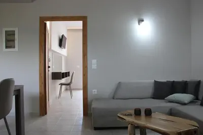 a living room with a couch and a table at Miva Sea View in Faliraki