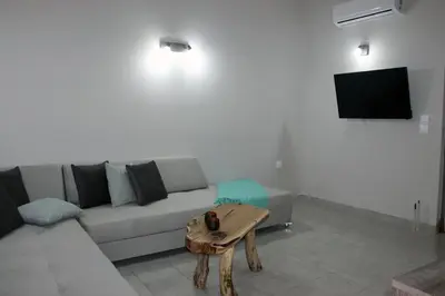 a living room with a couch and a table at Miva Sea View in Faliraki