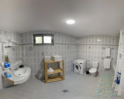a bathroom with a sink and a toilet and a shower at Miva Sea View in Faliraki
