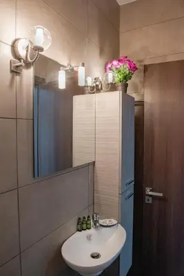 a bathroom with a sink and a mirror at Villa Oliva Rodos in Ialyssos