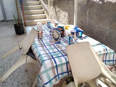 a picnic table with a picture of a man on it at Apollon Apartments H-2 in Rhodes Town