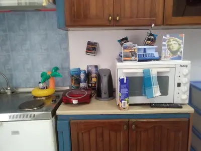 a kitchen counter with a microwave on top of it at Apollon Apartments H-1 in Rhodes Town