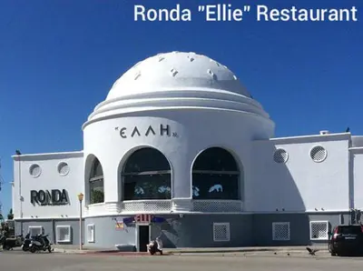 a white building with a dome on top of it at Apollon Apartments H-1 in Rhodes Town