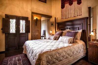 a bedroom with a large bed in a room at Lemuria Manor, Wine Dark Sea Villas in Rhodes Town