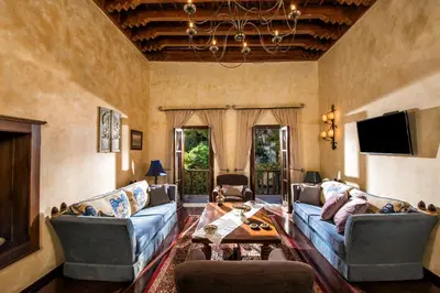a living room with two couches and a table at Lemuria Manor, Wine Dark Sea Villas in Rhodes Town