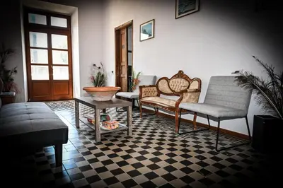 a living room with two chairs and a table at Nymph in Sálakos