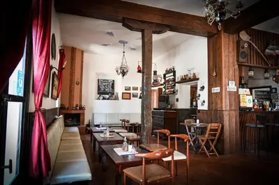 a restaurant with tables and chairs in a room at Nymph in Sálakos