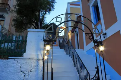 a stairway with lights on the side of a building at Dorian Hotel in Symi