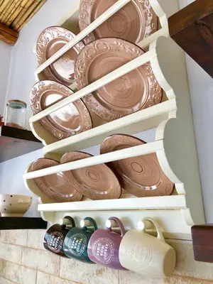 a box filled with plates and chocolate desserts at Bekos traditional house in Archangelos