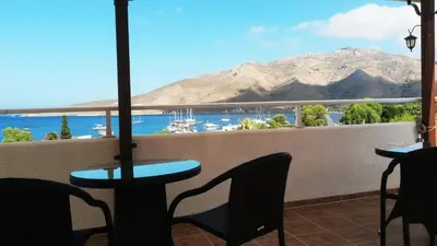 a balcony with a view of a marina at Apollo Studios in Livadia
