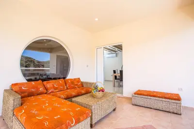 a living room with a couch and a table at MeFoMi Villa in Rhodes Town