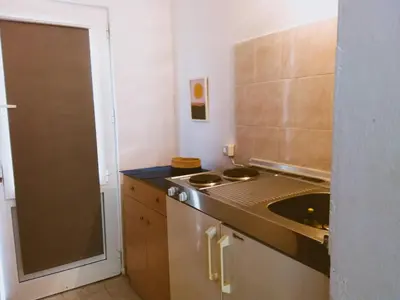 a small kitchen with a sink and a counter at Pension Zoi in Kolimbia