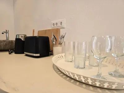 a group of wine glasses sitting on a counter at Pension Zoi in Kolimbia