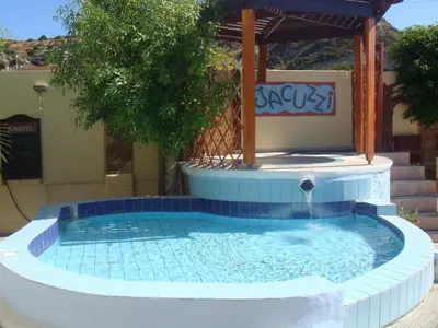 a small swimming pool with a gazebo at Billy's Studios in Faliraki
