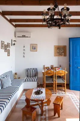 a living room with a couch and a table at Irene's house in Lachania