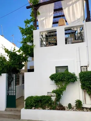 a white building with plants on the side of it at Villa Smaragdi-Despoina in Malona Village