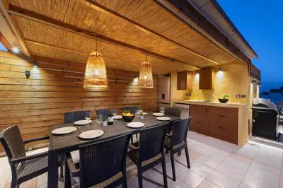 a dining room with a table and chairs in a kitchen at A Unique 3-4 bedrooms house in OLD TOWN in Rhodes Town
