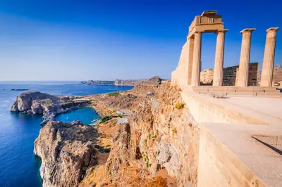 a temple on a cliff next to the ocean at Bakia Lindos in Líndos