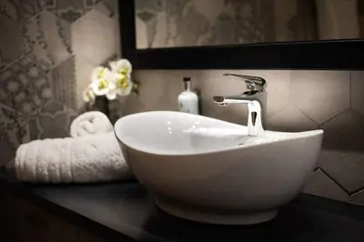 a white sink on a counter in a bathroom at Bakia Lindos in Líndos