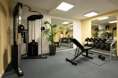 a fitness room with a gym with a mirror at Canvas by Mitsis Petit Palais in Rhodes Town