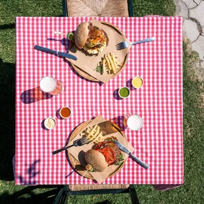a table with a plate of food on a red and white table cloth at Mitsis Rodos Maris in Kiotari