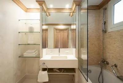 a bathroom with a sink and a shower at Mitsis Rodos Village in Kiotari