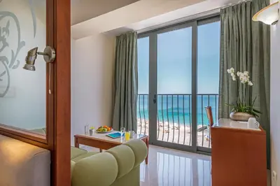 a hotel room with a view of the beach at Mitsis La Vita in Rhodes Town