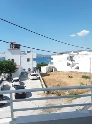 a view of a street with cars parked on the road at Haraki Sunrise Apartments in Haraki
