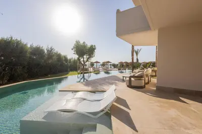 a view of a swimming pool from a house at Pegasos Deluxe Beach Hotel in Faliraki