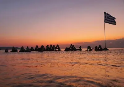 a group of people on a boat in the water at Tsambikos Apts in Faliraki