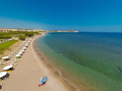 an overhead view of a beach with umbrellas and the ocean at Kolymbia Bay Art Boutique Hotel - Adults Only in Kolimbia