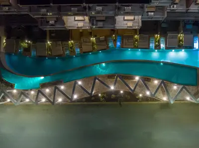 an aerial view of a pool at night at Kolymbia Bay Art Boutique Hotel - Adults Only in Kolimbia