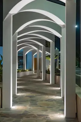 an arched walkway in a building at night at Kolymbia Bay Art Boutique Hotel - Adults Only in Kolimbia