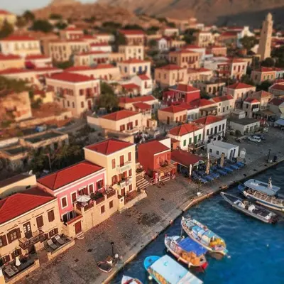 an aerial view of a town with boats in the water at House Galini in Halki